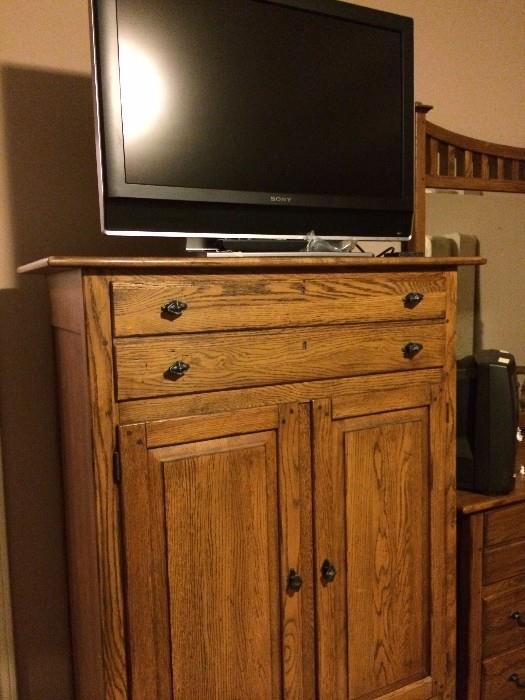 Rustic style armoire has matching dresser & nightstand; flat screen TV