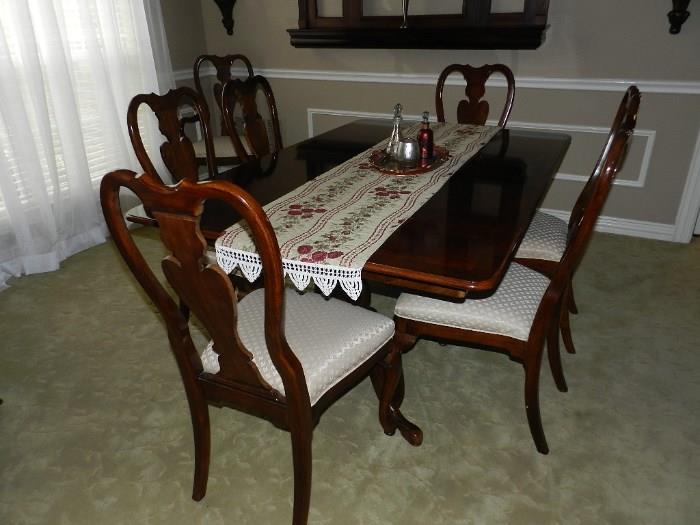 Dining Room Set - has 10 chairs (2 arm chairs and 8 side chairs).   In excellent condition except one of the chairs has a tear in the upholstery - recover them all to suit your taste and invite 9 of your favorite friends for dinner!  Would be lovely as is or even painted!