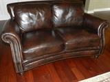 Leather loveseat in pristine condition.  
