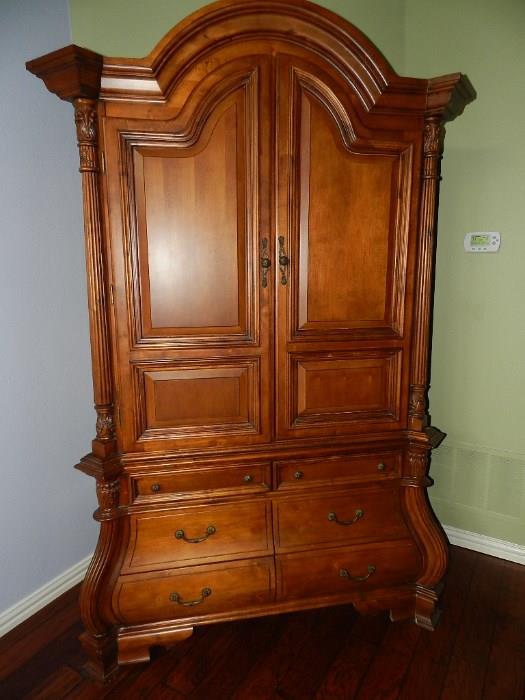 Large Armoire - space for TV and electronics or you can put a rod inside for storage.