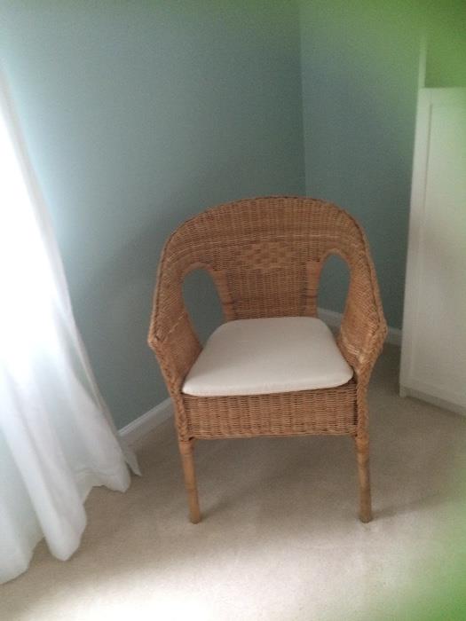 Wicker chair, cream cushion