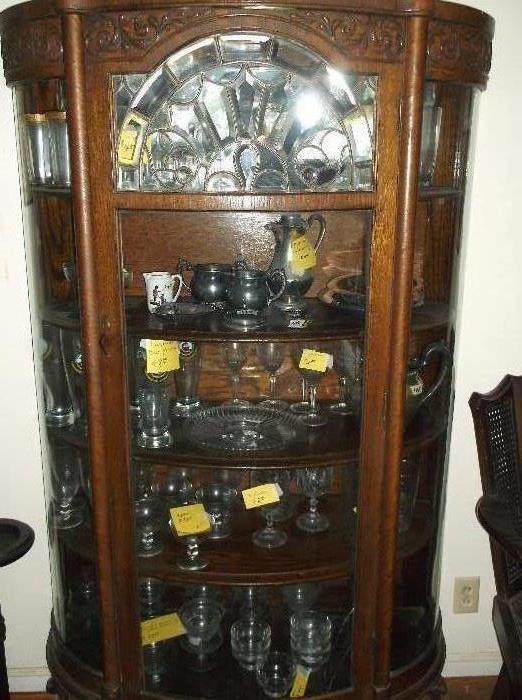 Oak bow front china cabinet w/claw feet and leaded glass