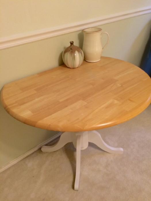 38" Round Double Drop Leaf Hard Wood Table w/White Base. Accessories Sold Separately.