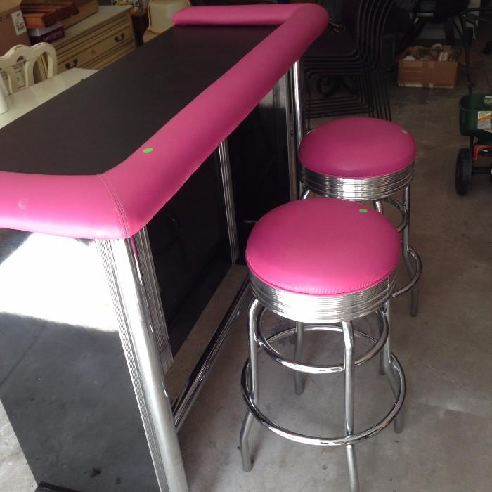 bar with two matching stools
