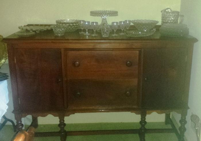 Large mahogany buffet. American Fostoria collection including round pedestal cake plate, large pitcher with ice lip, and much more!