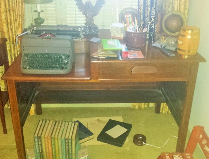 Desk with typewriter slot, other miscellaneous items.