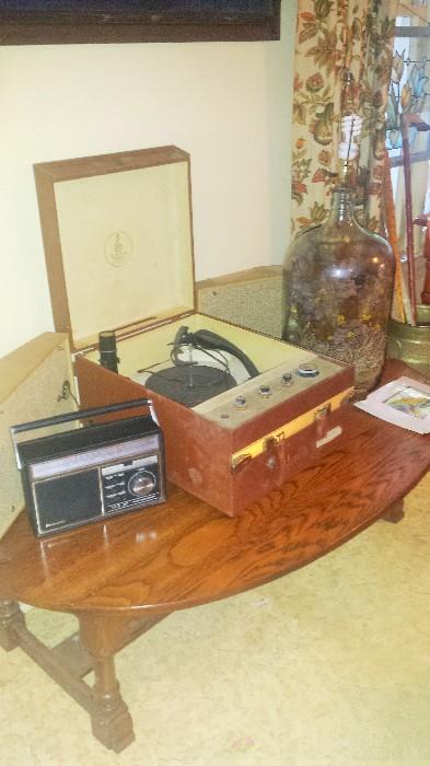 Drop leaf coffee table, Emerson phonograph with fold out speakers, 5 gallon bottle lamp, and more!