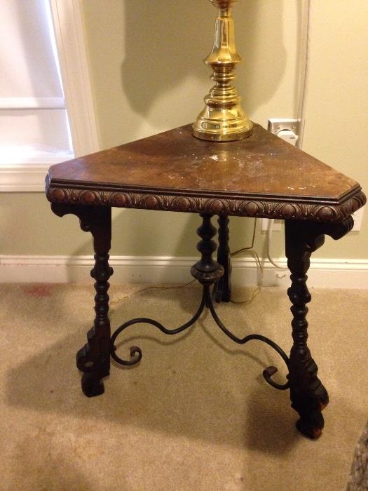 Wonderful corner table with iron accents - needs tlc