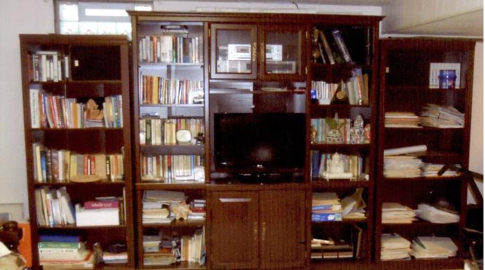 Large entertainment unit. Side book cases can be sold separately. This unit will be cleaned out before sale.