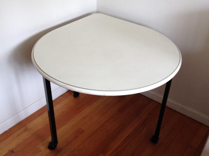 Teardrop shaped table with adjustable height legs. Two tables available.