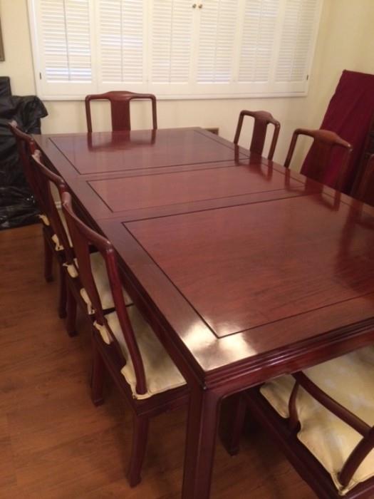 Chinese handmade rosewood dining table and chairs. Has an additional leaf too.