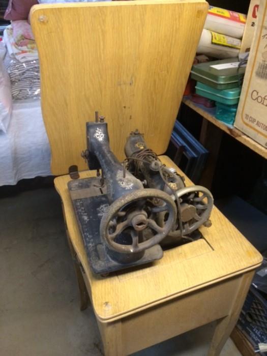 antique sewing machine with folding base and extra machine