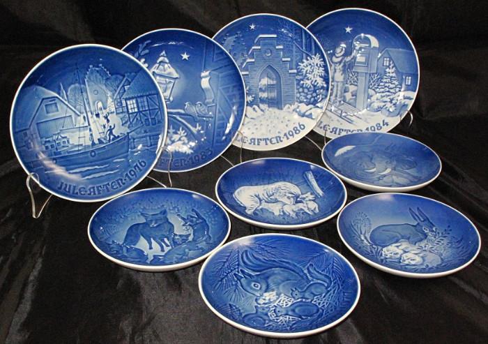 Bing & Grondahl Copenhagen Porcelain Christmas Plates: 1976 "Christmas Welcome" 2 ea, 1983 "Christmas in the Old Town" 2 ea, 1986 "Silent Night/Holy Night", 1984 "The Christmas Letter" 2 ea.  Not shown 1971 "Christmas at Home", 1972 "Christmas in Greenland" 2 ea, 1973 "Country Christmas" 2 ea, 1974 "Christmas in the Village".  Also Shown are Mother's Day Plates 1977, 1979, 1981, 1986 & 1987