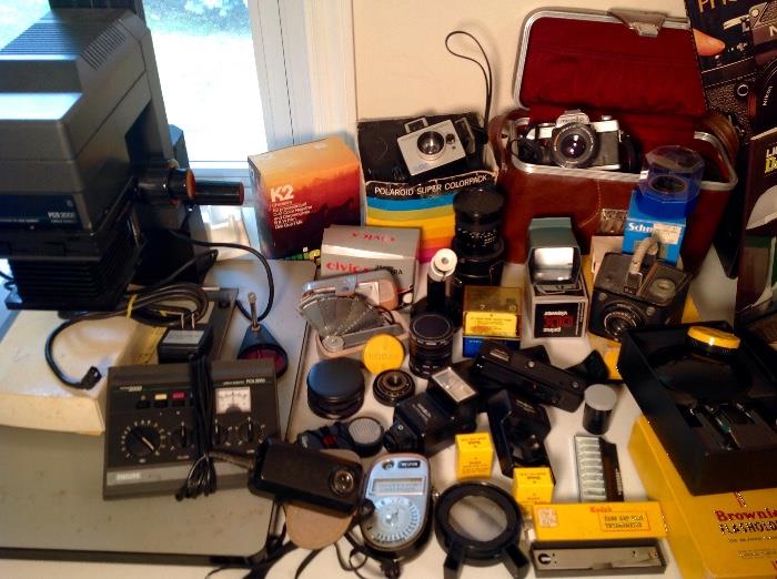 Phillips Color Enlarger, Phillips color analyzer PCA-2060, Westin Light meter, Poloraid Land Camera with super color pack, Civica 35mm camera, Minolta xg7 with case, Brownie Camera 620 and equipment, Assortment of Lens and light diffusers, flashbulbs and so much more!