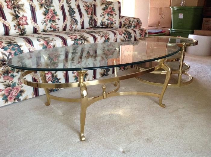Oval glass and brass base coffee table.