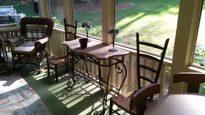 Stone topped console table flanked by two antique Italian vintner chairs, w/rush seats.