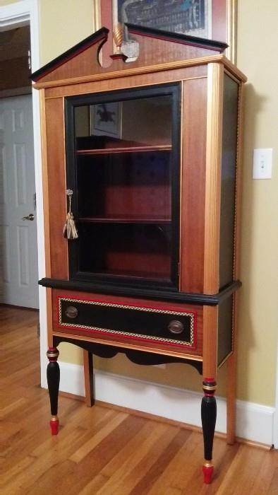 One-of-a-kind, hand painted china cabinet. Very nice job of repurposing a basic mahogany piece, into something unique and attractive. There ya go.