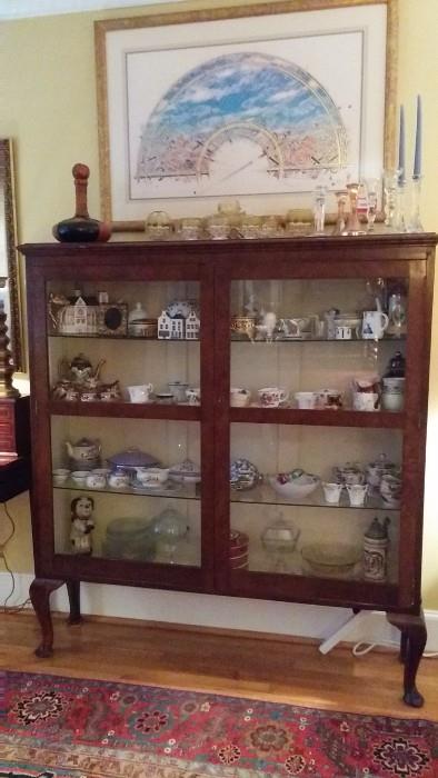 Antique wooden bookcase, w/3 glass shelves and filled with old lady collectibles and sparkly things - my favorite!