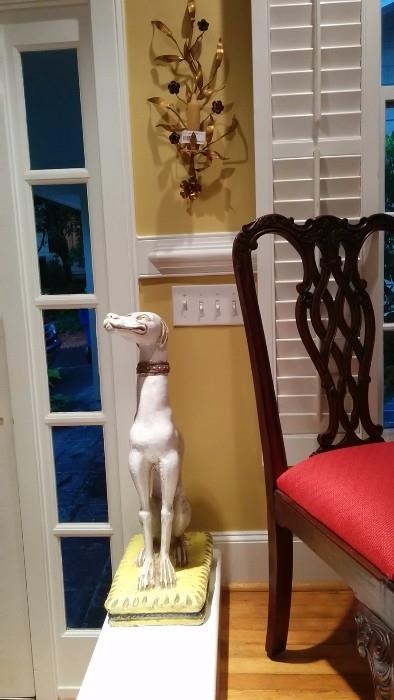 Vintage Italian terra cotta Greyhound, with nicely contrasting vintage Italian metal wall sconce.