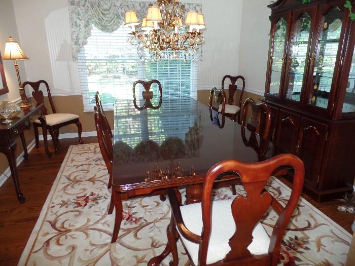  Queen Anne Dinning room table with two extra leaves and 8 chairs. With matching China Cabinet, side table and mirror.    Sorry, Rug NOT for sale
