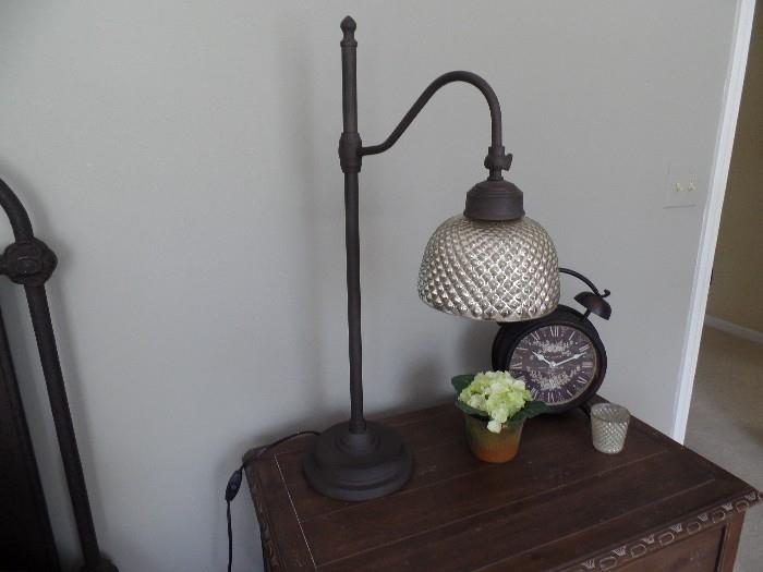 Wrought iron lamp with sliver globe