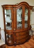 Beautiful curved glass china cabinet by Huntington furniture. It is part of the St. Leone dining room set