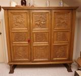 German carved gun cabinet