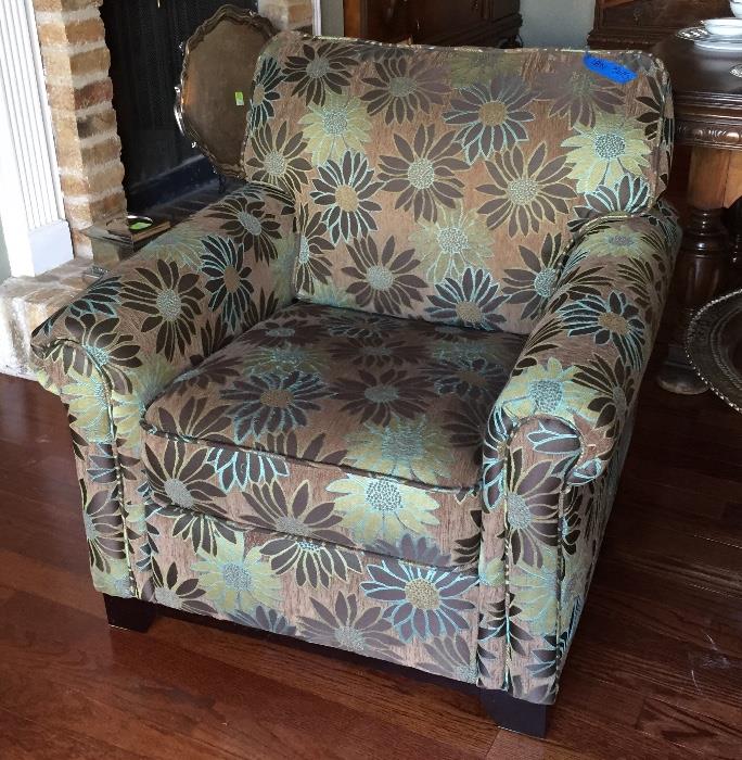 One of two contemporary floral chairs.
