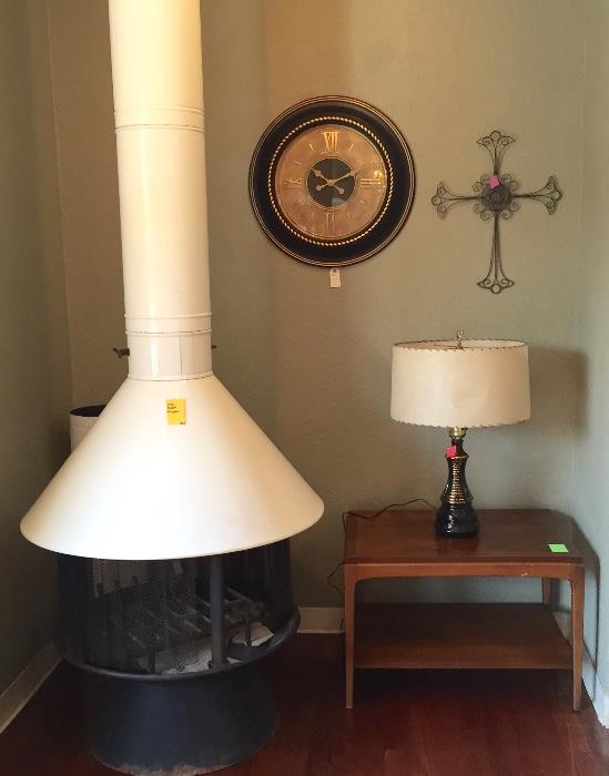 1970 Malm enameled steel wood burning fireplace, Lane end table, wall clock, cross and mid-century lamp.