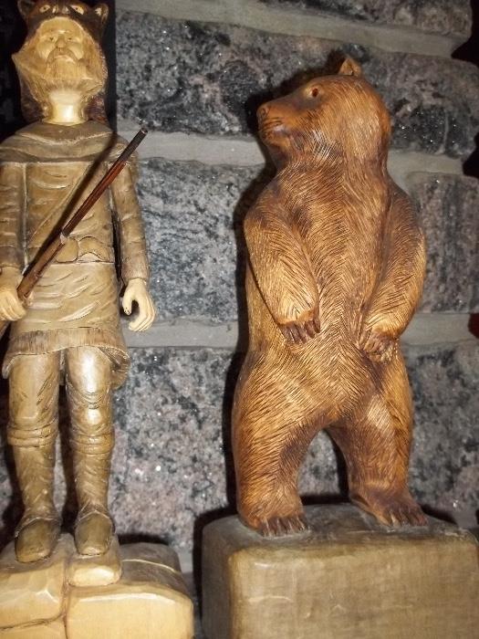 Frontiersman and bear locally made wood carving.