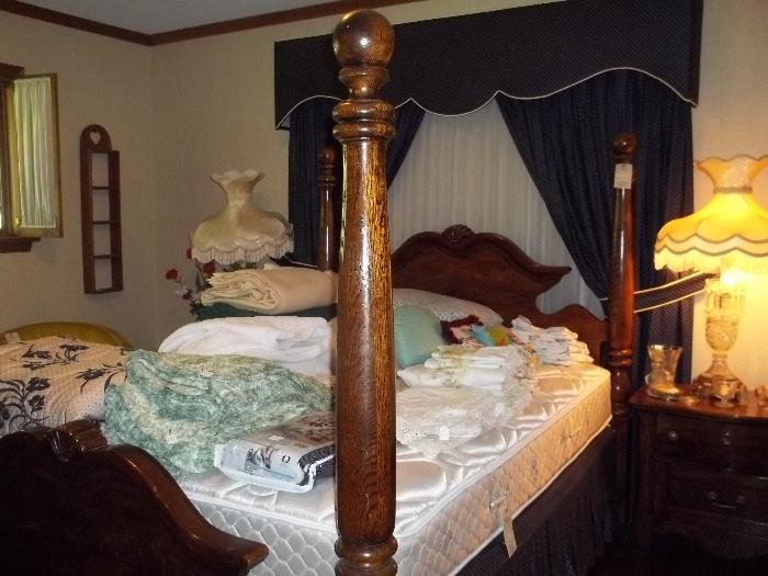 Striking dark wood four-poster queen bedroom set