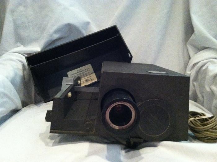 Sawyers slide projector. Light and fan work, all moving parts operate smoothly.
