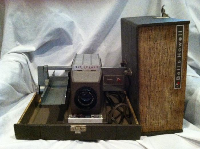 Bell & Howell slide projector. Light and fan work, all moving parts operate smoothly.