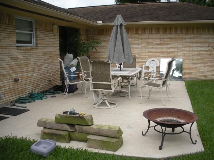 9 piece patio set (table, 6 chairs, umbrella & stand) hoses, fire pit, stone logs for landscaping, patio pillows and more!