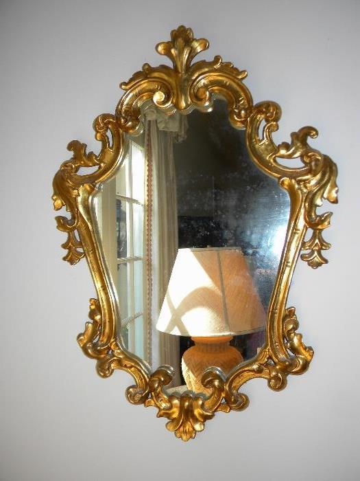 One of a pair of Italian gilt mirrors