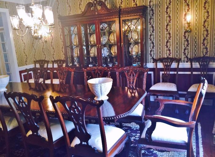 Mahogany Dinning Room Set including a 9 3/4 foot (117 inches)Three Pedestal Formal Table with two 18 inch leaves (opens to a full 12 3/4 foot (153 inches) , 14 Chippendale style chairs and a China Cabinet imported from Indonesian.