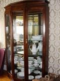 Nice and newer china cabinet filled with Noritake china.