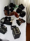 Modern film cameras and lenses and binoculars.
