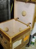 Vintage small steamer trunk, canvas and leather, with vintage Matson line stickers. Odd bumps inside suggest specific item was to be stored, but we don't know what???