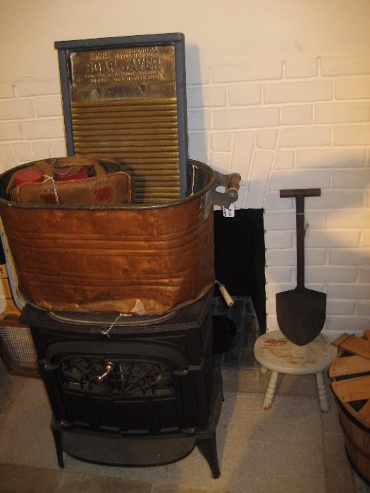 WWI trench shovel, brand new wood stove, antique washboard, copper wash basin