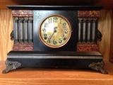 Ingraham Brass Face Black Mantle Clock. Four Pillars Each Side.