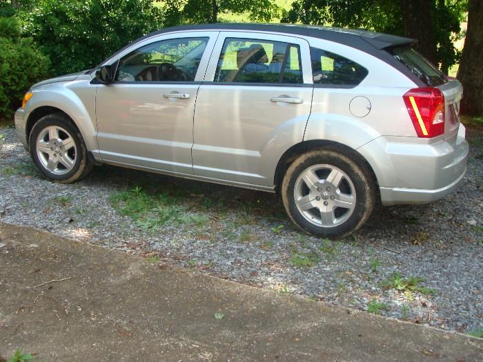 2009 Dodge Caliber with 17,030 original miles in like new condition! Features: SXT, 2.0L, Air, Power Windows, Doors, Mirrors, Tilt Wheel, Cruise, CD & MP3 ***  Plus Vintage Flatbed Truck!