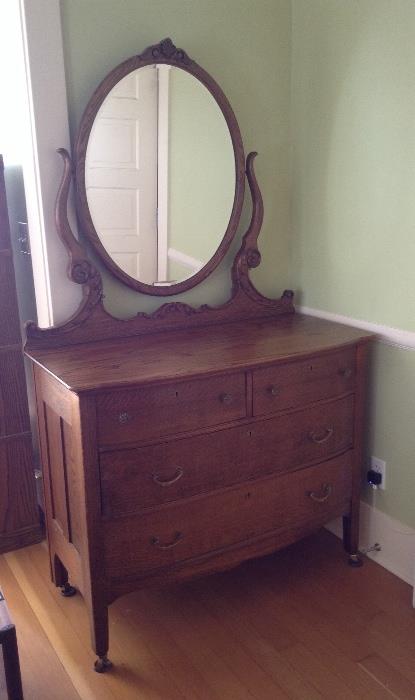 Antique oak dresser with bevelled oval mirror