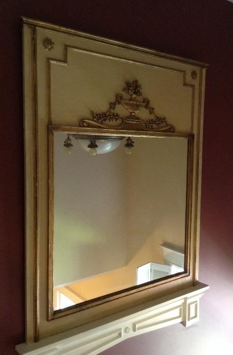 Large 48" x 57" gilt & pale yellow plaster mirror - it's sitting on a white wall-mounted shelf that is not part of the mirror (N.B. Odd reflection in mirror is the bottom of a light fixture)