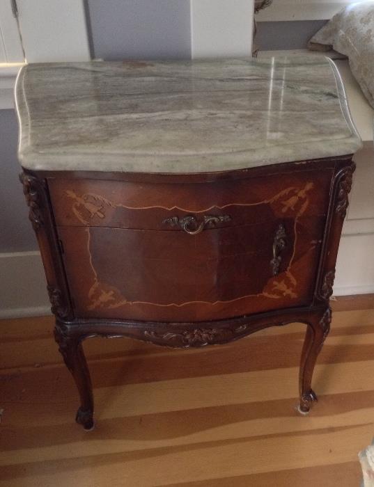 One of a pair of marble top nightstands - they match the chest in last photo