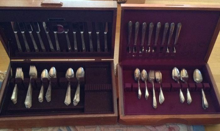 Two Rogers silverplate flatware sets - one on the left is service for 11+ (62 pieces), the one on right is service for 8 (49 pieces)