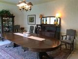 antique dining room table with chairs, curio cabinet. buffet, area rug 