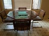 glass top table with matching chairs