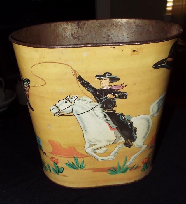 ANTIQUE COWBOY AND COWGIRL WASTE CAN
