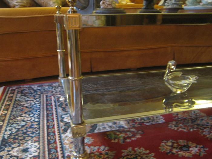 close up of brass / chrome and glass coffee and side tables